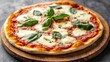 © SETSU ST - Traditional Italian pizza margherita with fresh basil leaves and mozzarella cheese on a wooden board.