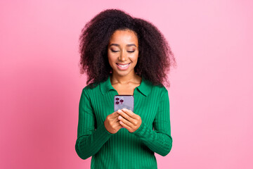 Sticker - Photo portrait of attractive young woman hold device dressed stylish green clothes isolated on pink color background