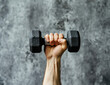 © reddish - Close-up of Hand Holding Dumbbell