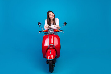 Canvas Print - Full length photo of lovely teen lady ride motorcycle look empty space dressed stylish white garment isolated on blue color background