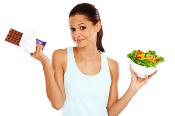 Chocolate, salad and portrait of woman for decision in studio for healthy eating, wellness and nutrition. Choice, diet option and isolated unsure person with vegetables and candy on white background