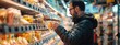 © Juan - Man shopping for groceries in a supermarket aisle