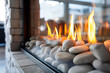 © tynza - Close-up of a modern gas fireplace with a clean, glass front, showcasing the flames dancing over decorative .