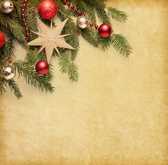 Canvas Print - Red and gold  Christmas decorations and fir branches on old yellowing  paper background...