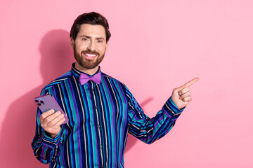 Canvas Print - Photo of attractive elegant man wear trendy striped clothes bowtie recommend empty space isolated on pink color background