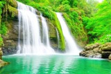 Fototapeta Krajobraz - waterfall with green leaves, moss, and trees