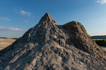 Active mud volcano cone formation near Buzau, Romania. These small, volcano-shaped mounds, usually a few meters tall, result from deep volcanic gas eruptions.