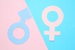 © New Africa - Gender equality concept. Male and female symbols on color background, flat lay