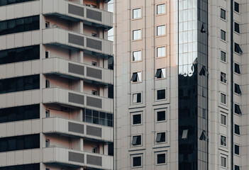 Wall Mural - many windows and walls facade of a modern skyscraper without people