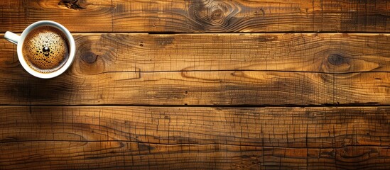 Poster - Wooden background with a coffee cup offering ample copy space image for your design