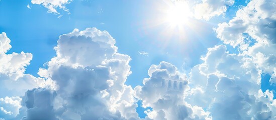 Wall Mural - sunny summer sky with fluffy white clouds and ample copy space image available