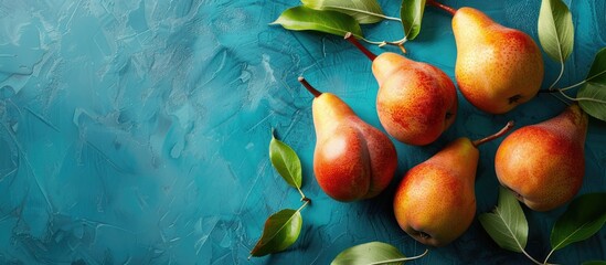 Aufkleber - Fresh pears and leaves on a blue backdrop with copy space image