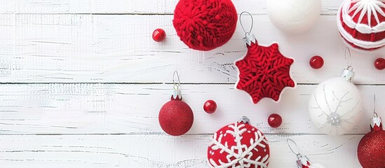 Poster - Red felt Christmas ornaments displayed on a white wooden table with copy space image