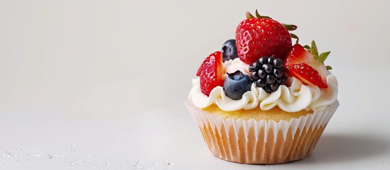 Aufkleber - Mini fruit cupcake in paper on a white backdrop with copy space image