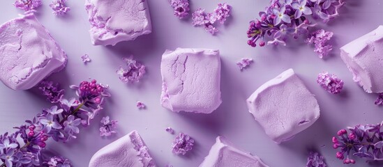 Aufkleber - Top view of a homemade marshmallow in violet color set against a background of lilac flowers and zephyr ideal for copy space image