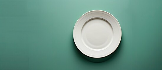 Poster - An overhead view of an empty plate on a table with a background perfect for a copy space image