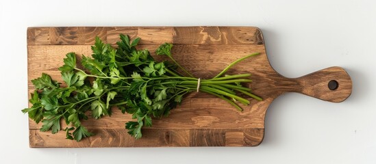 Poster - Rectangular cutting board adorned with parsley leaves on a white background featuring copy space image