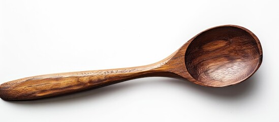 Poster - Isolated on a white backdrop a wooden spoon is displayed with ample copy space image