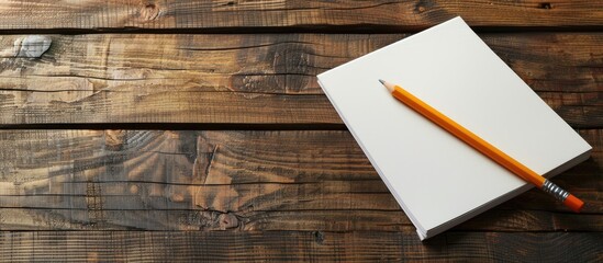 Aufkleber - Wooden table with pencil on blank notepaper offering copy space image