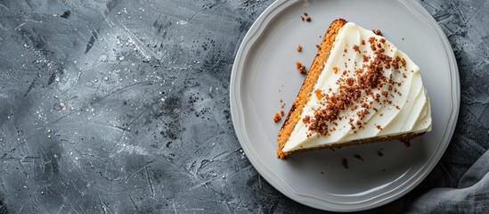 Poster - Top view of a vegan raw carrot cake on a gray stone surface with copy space and selective focus showcasing a slice of healthy homemade cake