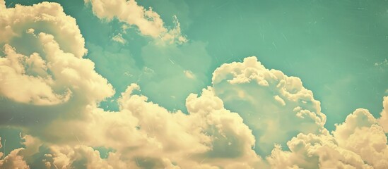 Poster - Vintage hipster background featuring a beautiful blue sky with fluffy white clouds ideal for adding text or images copy space image