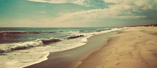 Sticker - Vintage filter enhances color in a serene beach landscape with empty sand providing copy space for an image