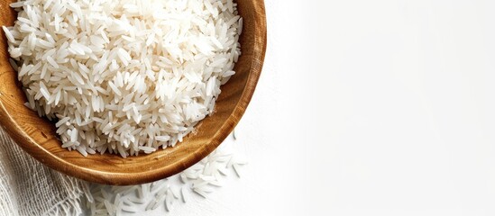 Wall Mural - High quality close up image featuring White Basmati rice against a white backdrop with ample copy space