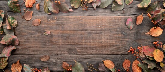 Fototapete - A wooden background decorated with autumn leaves provides a perfect copy space image