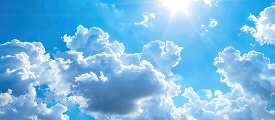 Fototapete - Sunny day with a clear blue sky and fluffy white clouds perfect for a picturesque copy space image