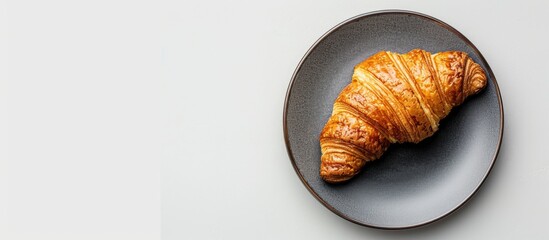 Aufkleber - French croissant on a plate with copy space image against white backdrop