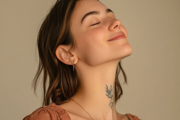 A close up of a woman's face with tattoos and her eyes closed