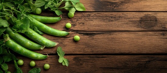 Aufkleber - Freshly peeled green peas on a brown wooden table with copy space Fresh green pea pods arranged in a horizontal composition isolated on an old rustic wooden surface with a soft focus