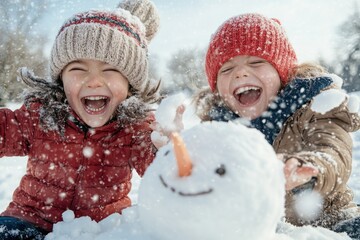 Wall Mural - Two kids in colorful winter attire laugh and play while building a cheerful snowman in the midst of a beautiful, snowy environment, celebrating winter fun.