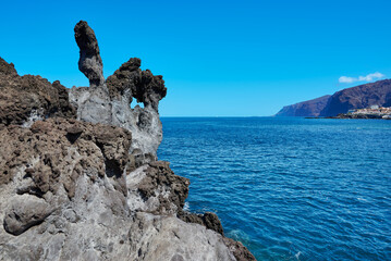 Volcanic rocks at Cueva de la Vaca and the Atlantic Ocean in Santiago del Teide Tenerife Spain