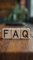 Sticker - Wooden blocks with FAQ text on a wooden surface