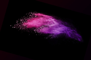 Wall Mural - explosion of colored powder and dust smoke splash pink and purple on black background