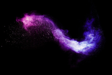 Wall Mural - explosion of colored powder and dust smoke splash pink and purple on black background