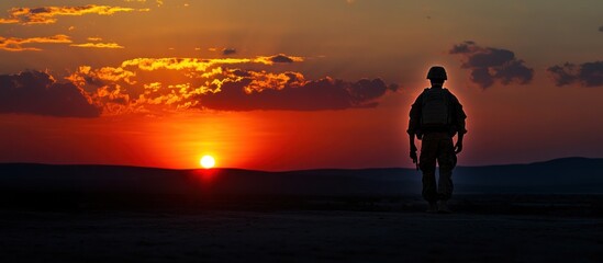 Wall Mural - Silhouette of a Soldier at Sunset