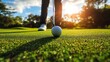 © Ariep - A Golf Ball on a Putting Green with a Golfer in the Background