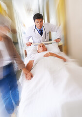 Poster - Doctor, bed and running for emergency in hospital with urgent surgery, healthcare and moving fast. Surgeon, patient and hurry for medical crisis with motion blur, accident injury and rush in clinic