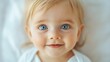 © SynthArt BWG - A baby with blue eyes is smiling