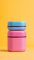 Wall Mural - Two containers of different colors, one blue and one pink