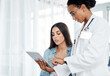 © peopleimages.com - Doctor, consultation and woman on tablet with patient to show update, advice and test results. Tech, medical professional and talking with client for help, checkup and healthcare report in hospital