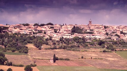 Wall Mural - Hilltop Puimoisson village in France. Provence landscape in summer with lavender fields. Plateau Valensole, Alpes de Haute Provence.
