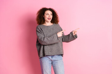 Wall Mural - Photo portrait of lovely young lady look point empty space dressed stylish gray garment isolated on pink color background