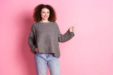 Wall Mural - Photo portrait of attractive young woman point empty space dressed stylish gray clothes isolated on pink color background