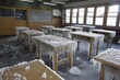© ylivdesign - Icicles are hanging from desks and a chalkboard in an abandoned classroom after a pipe bursts