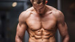 © July P - Athletic man with defined muscles and abs, posing in a studio with a neutral background. Fitness and bodybuilding concept.