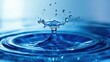 © savittree - A close-up of a water drop hitting blue liquid, capturing the moment of impact and the resulting splash