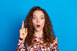 © deagreez - Photo portrait of pretty young girl point up think eureka wear trendy colorful outfit isolated on blue color background